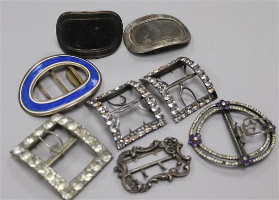 A group of antique buckles